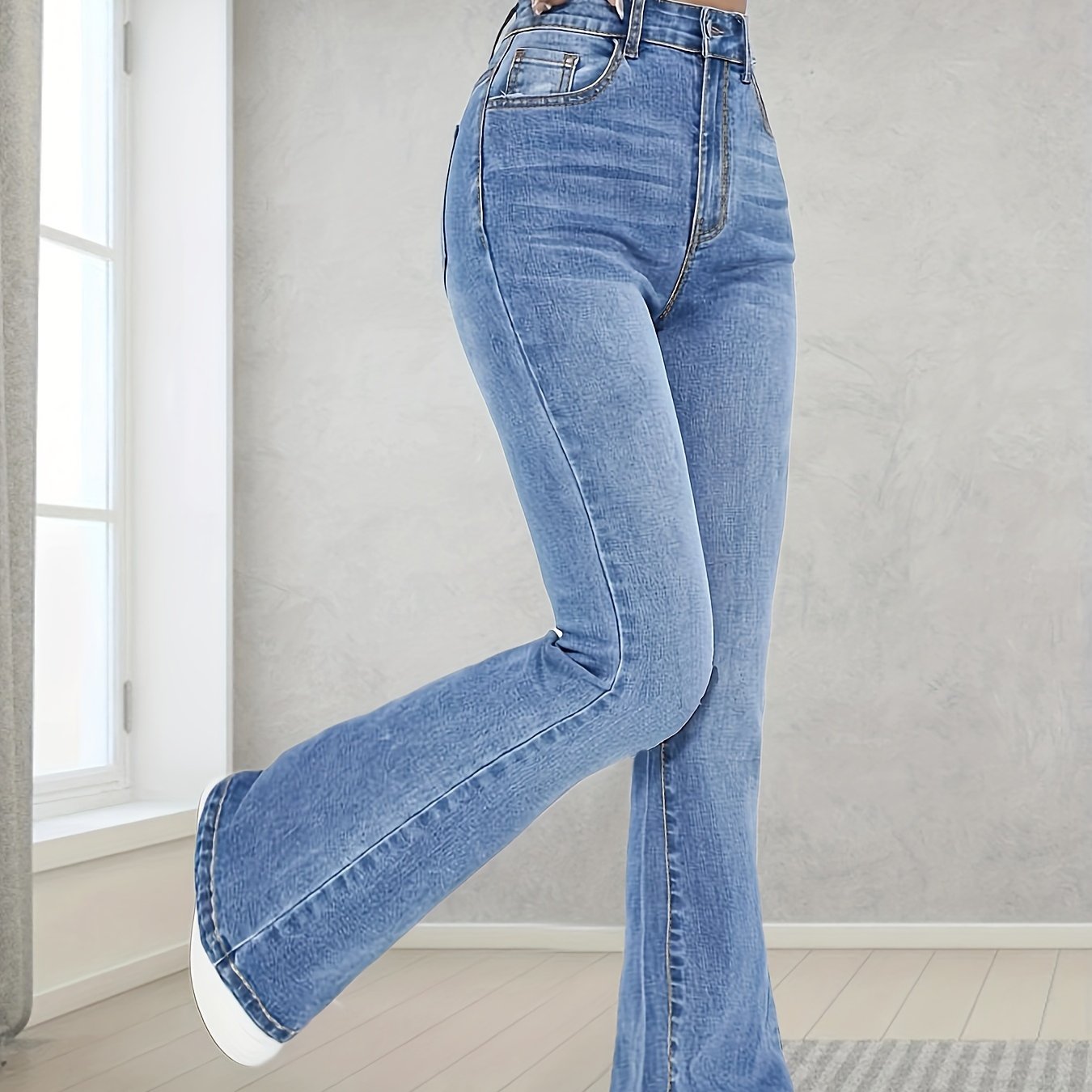 Fashionable And Versatile High-Waisted Stretchy Blue Flared Jeans for Women.